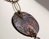 Thirteen Embossed Irridized Caged Copper Pendant