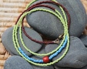 one red bead . a soul mantra seed bead necklace