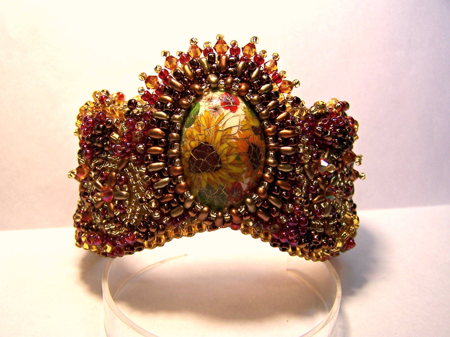 Bead  embroidered wave cuff bracelet  featuring handcrafted sunflower cabochon