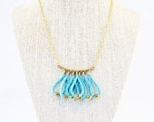 Looped fringe necklace in aqua suede