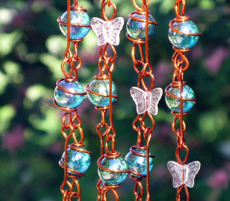 Iridescent Teal Suncatcher with Copper Wrapped Marble Prisms and Petal Pink Glass Butterflies