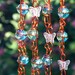 Iridescent Teal Suncatcher with Copper Wrapped Marble Prisms and Petal Pink Glass Butterflies