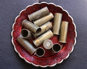 12 empty brass shell casings - 32x13mm