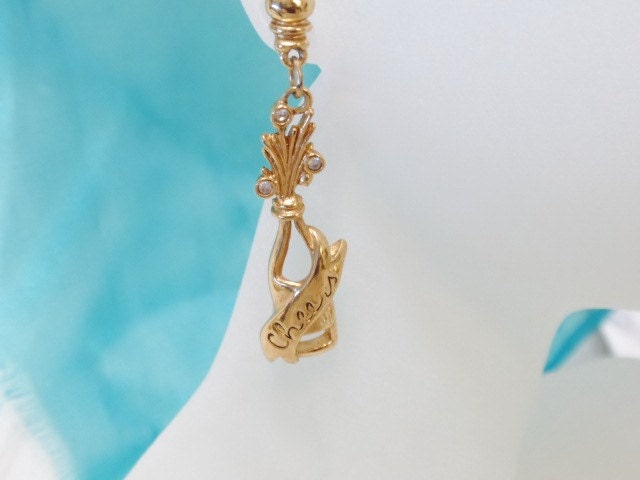 Earrings celebration  Cheers written on a bottle of Champayne  Length 2 inches