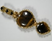 Woven wire wrapped natural Tiger Eye hearts with tiny Onyx hearts, pendant