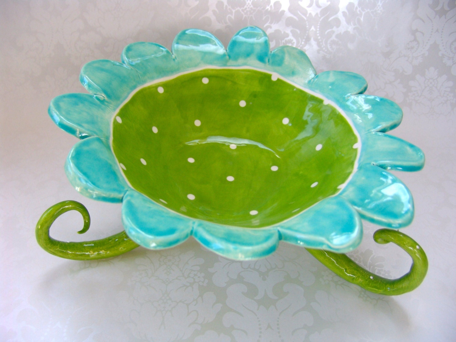 whimsical polka dot turquoise & lime serving dish with curly legs