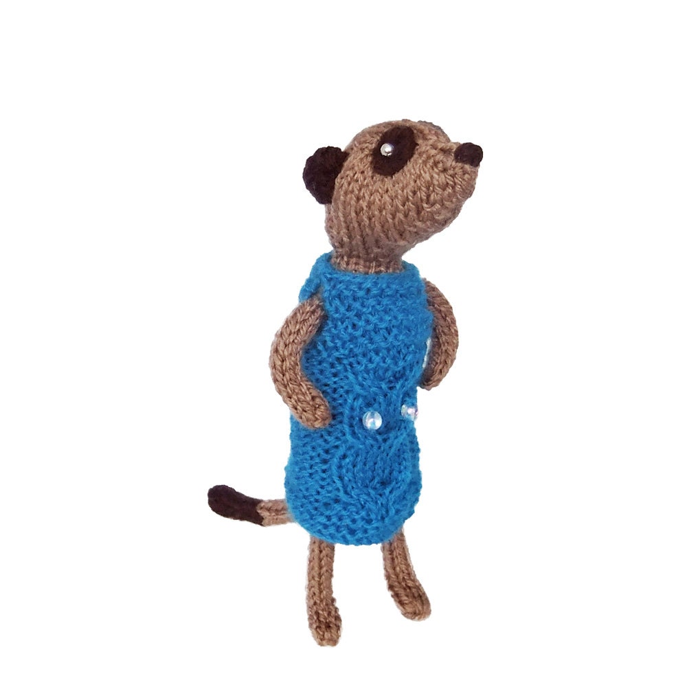 Handknitted Meerkat Model wearing owl cable dress, cute meercat, fashionable animal plush