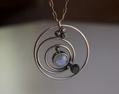 Galaxy.....moonstone, solar system pendant