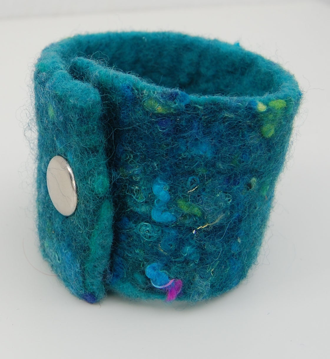 Mermaid Cuff - A handfelted cuff in Turquoise and Teal Merino Wool with fun and sparkles.