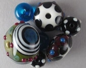 Handmade Lampwork Glass Bead Set of 7 by Patti Cahill, sra -- Picasso's Plate color scheme with bullseye focal