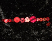 Red button-jar bracelet 7 1/2 inch length