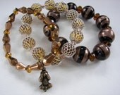 Bracelets ..Lampwork,Silver Metal Lace, and Copper..with Swarovski Crystals.. Stretch