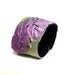 Bright leather cuff bracelet in green and purple color. Leather jewelry