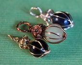 Custom caged gemstone pendant