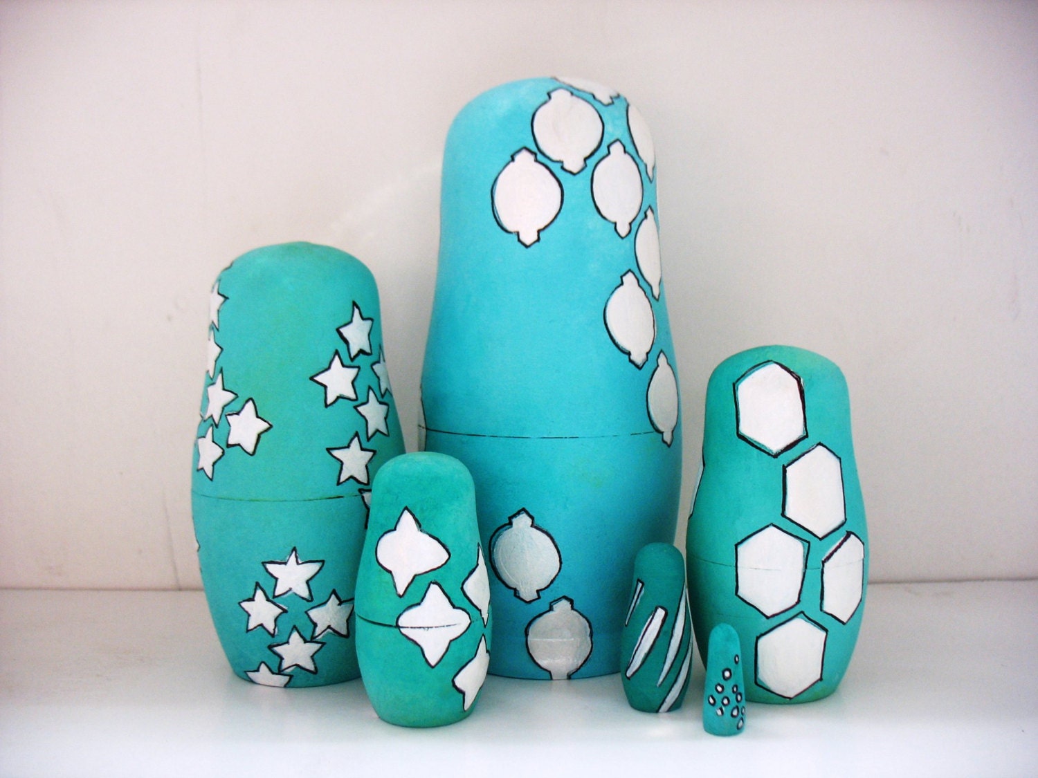 handmade wood folk art nesting dolls....geometric shapes