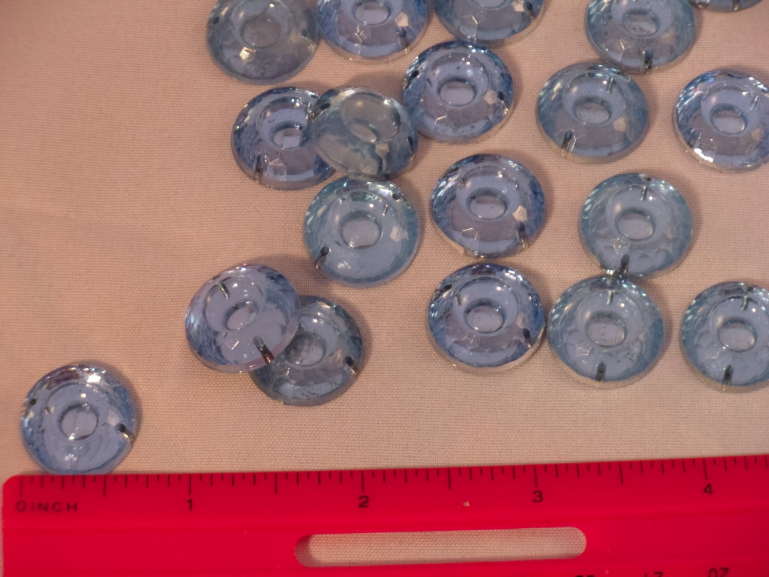 Light blue flat-backed round sew-on gems