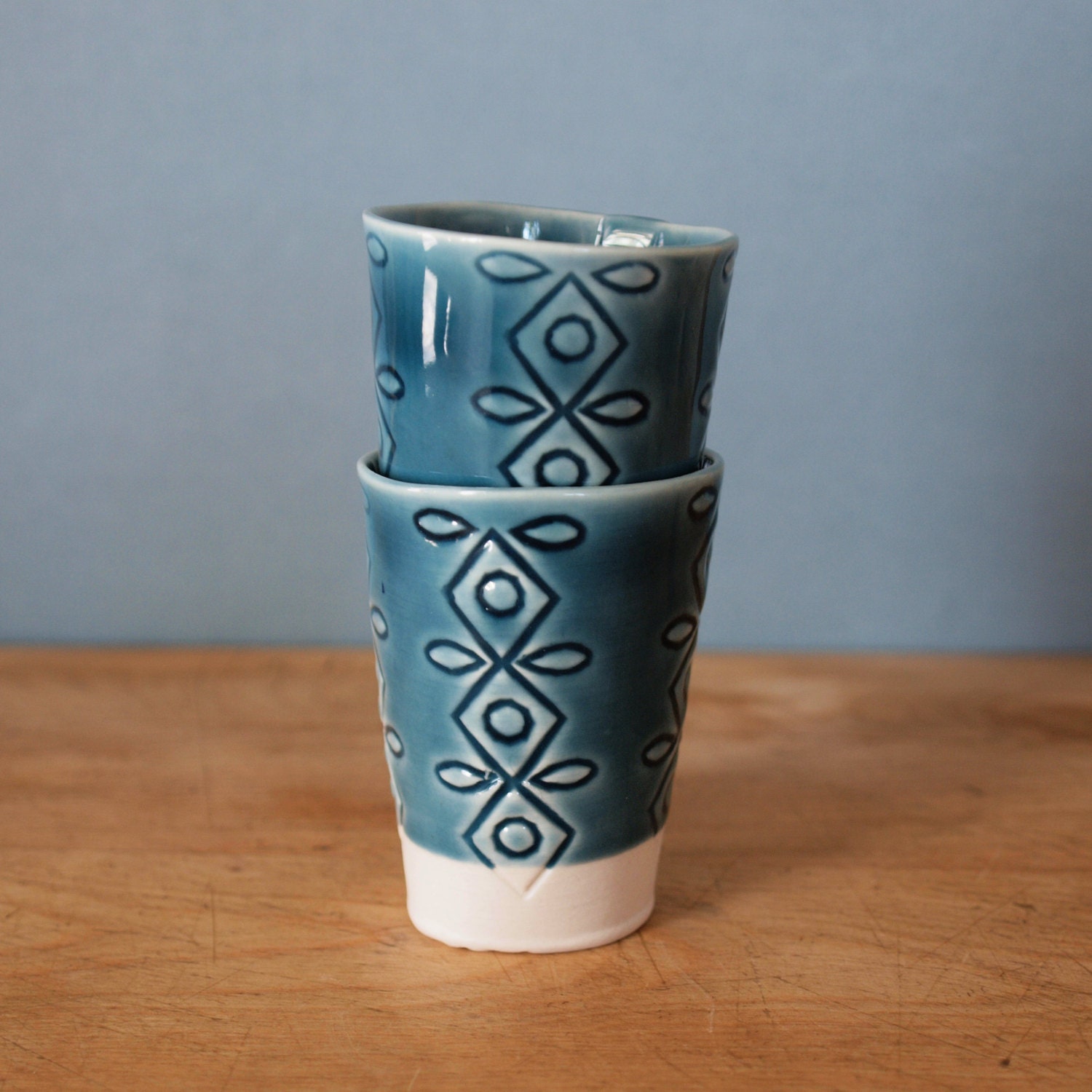 pair of teal shot glasses