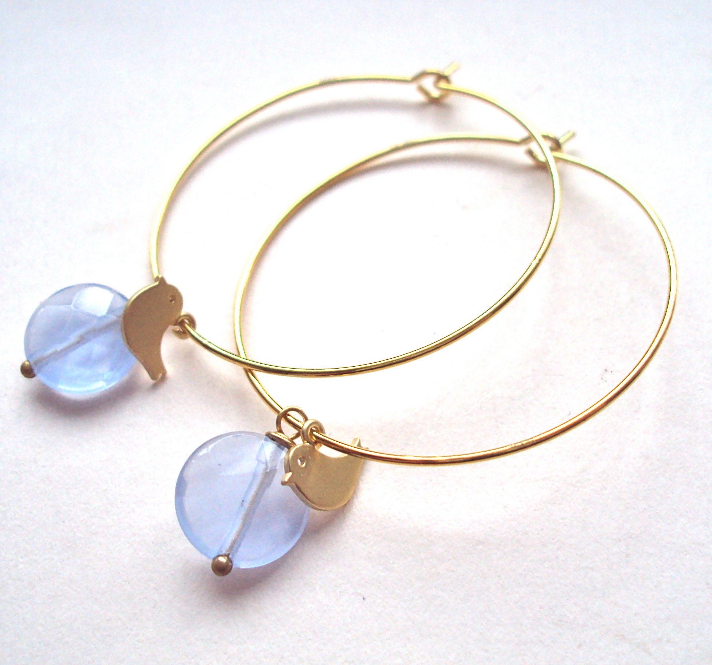 Gold Hoop Bird earrings with purple quartz