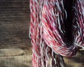 Pink and white two ply handspun yarn
