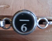 Six and underscore sign typewriter key bracelet