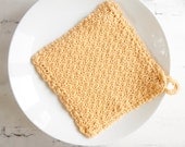 Crochet pot holder, hot pad or oven pad in honey yellow