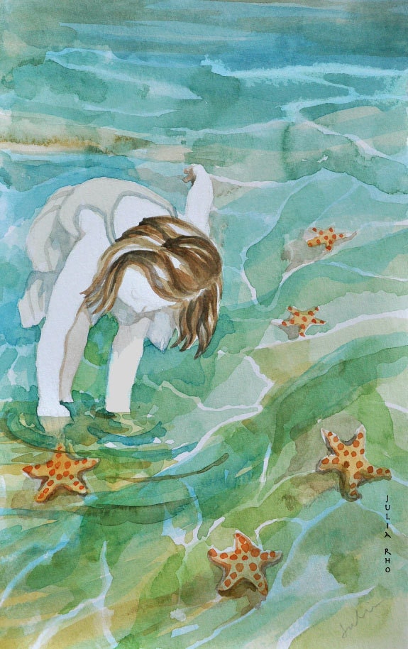 girl picking up starfish