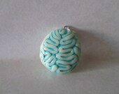 Glow in the dark brain pendant black light responsive