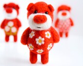 Bright red felted miniature pocket bear with cammomiles