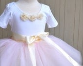 Blush pale pink fluffy tutu. This style was featured in Martha Stewart Wedding Magazine Spring 2011 Flower Girl layout.
