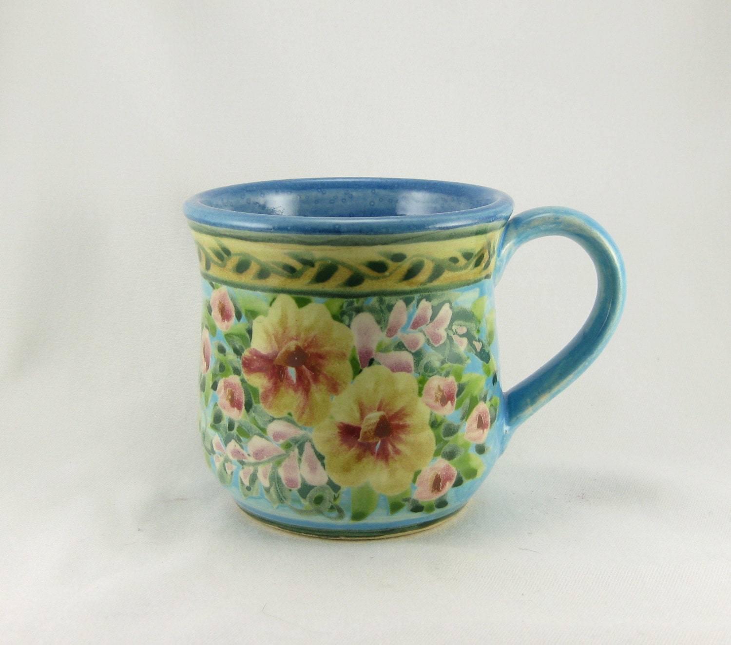 Blue handmade and painted porcelain coffee cup