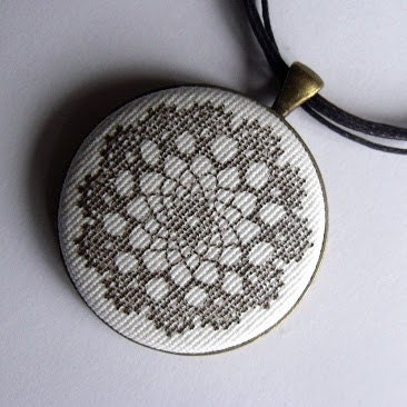 Hand stamped cotton fabric cameo pendant necklace with antique bronze rounded back