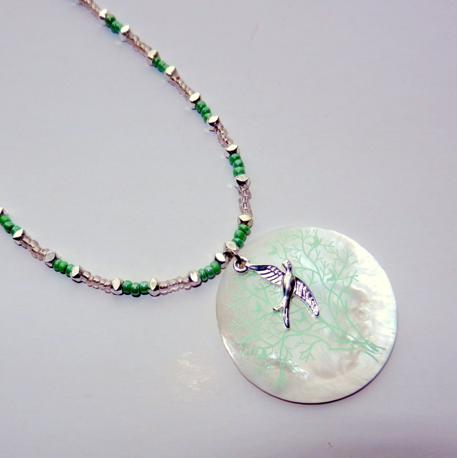 Beaded Necklace with Bird and Shell Pendant
