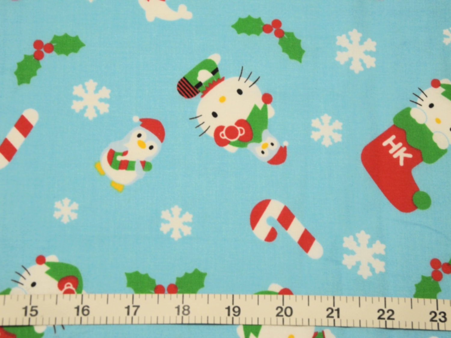 Blue Fabric with Hello Kitty and Christmas Stockings  by the Yard