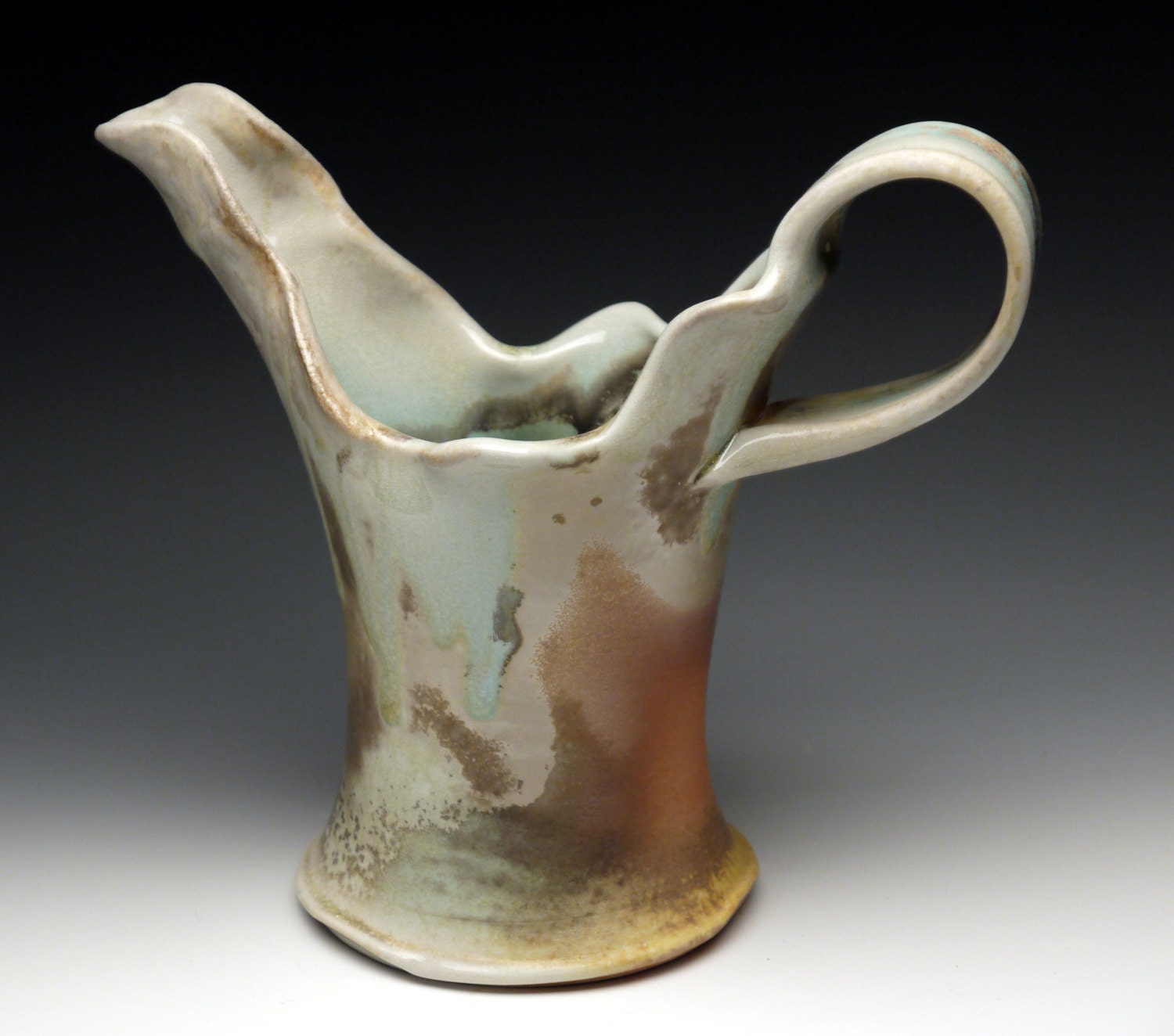 Porcelain Pitcher, woodfired, with Oribe glaze and Avery Flashing Slip