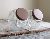 Pair of vintage hexagon shaped glass jars, with dark chestnut lids