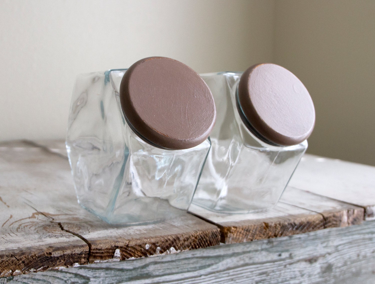 Pair of vintage hexagon shaped glass jars, with dark chestnut lids