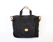 black canvas luggage cross over duffel bag