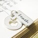 teacher apple cutout and hand stamped word tag teach sterling silver necklace
