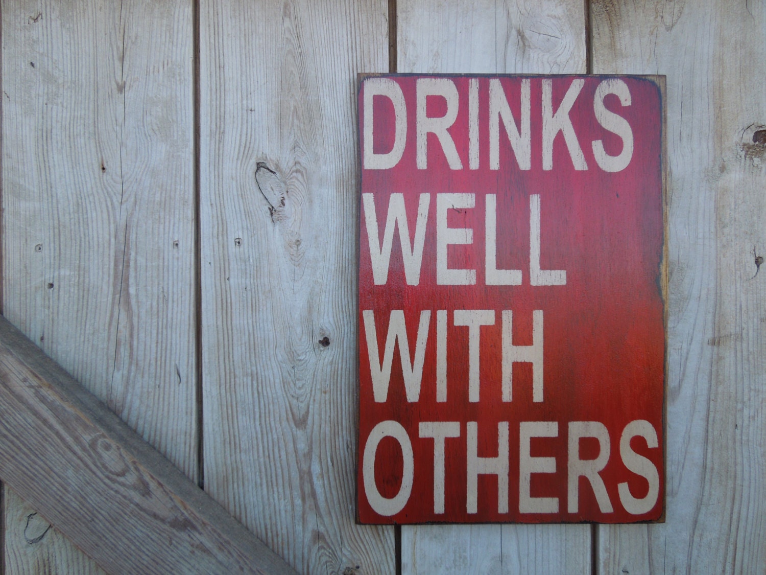 Drinks well with others sign made from reclaimed plywood