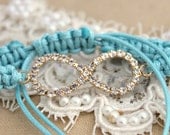 Rhinestone Infinity Friendship bracelet Tiffany blue 14 k goldfield braided bracelet with white zircons.