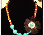 Orange, chartreuse and turquoise bead necklace with leather flower