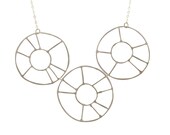 Handmade jewelry. Sterling silver three wire wheels necklace. Custom fashion jewelry.