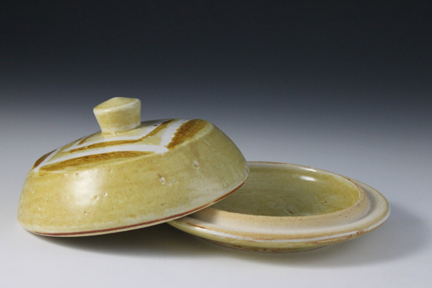 Round butter dish -- Golden yellow with wax resits and Iron line work