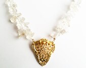 Gold chain and quartz crystal necklace