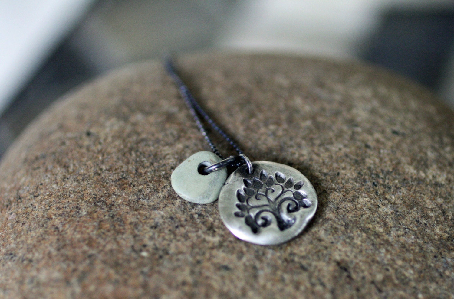 Be charming. Fine silver tree of life charm with river stone accent