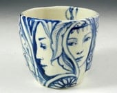 Blue and white porcelain story cup with queen, cat, ladies and bird