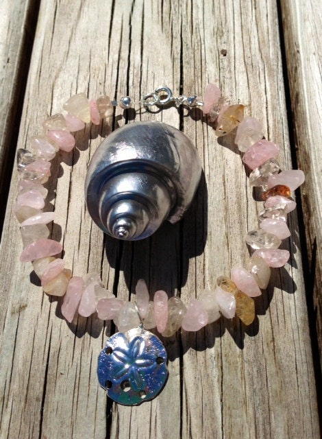 Pale pink/light brown glass beaded bracelet with sand dollar charm