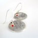 Simple round sterling silver earrings, eached with red dot