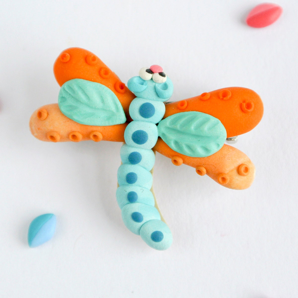 Colorful Dragonfly brooch hand sculpted in blue and orange polymer clay