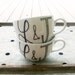 custom couple caricature mugs with initials - hand drawn portraits on tea cup pair - set of two (2)